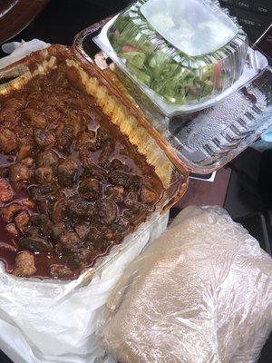 Berbere Beef, mushroom, salad, and Injera.