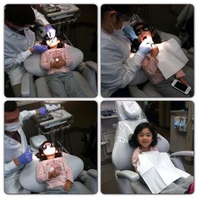 My daughter getting her teeth examined by Dr. Becker