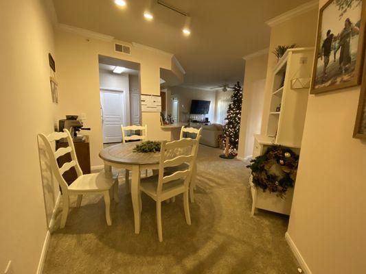 Dining room. Looks into the living room. Only negative is I don't love a carpeted dining room, BUT obviously just personal preference