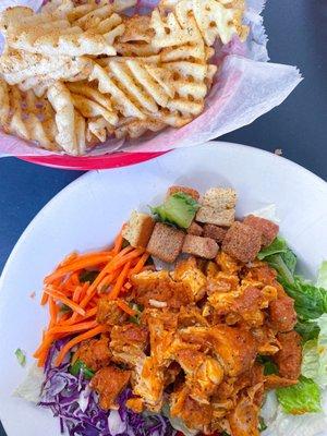 Buffalo chicken salad (chicken tossed in spicy lemon pepper) and a side of waffles fries tossed in spicy ranch