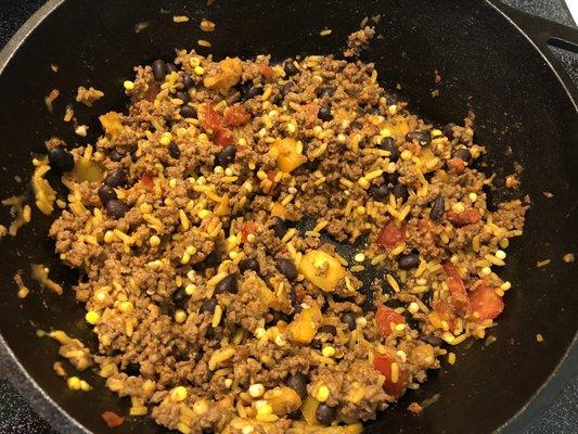 Stuffed poblanos filling with gold and red tomatoes and corn that I cut from the cob