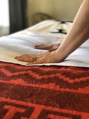 Reiki is applied with light hands-on touch or no touch with the practitioner's hands hovering over the body.