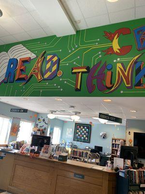 Front desk with colorful mural