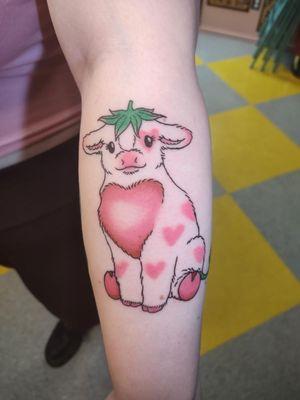 Adorable strawberry cow tattoo