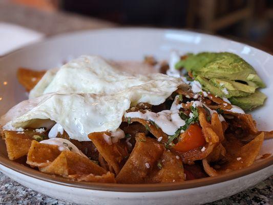 Chilaquiles Rancheros with add on: Carnitas (hidden under eggs).