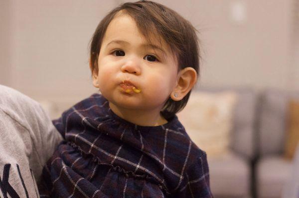 Celeste eating yummy food from mamma.