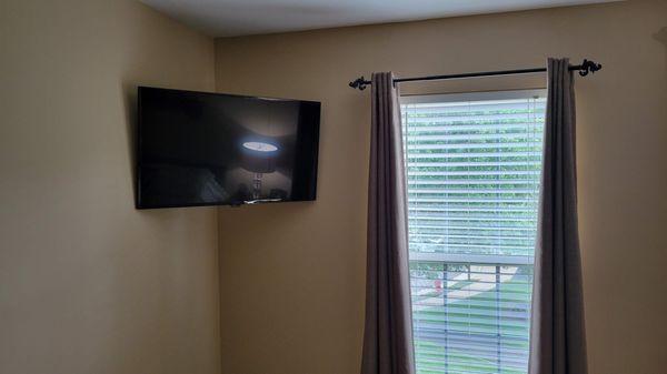 Bedroom install with power outlet extension installed. Multiple HDMI extensions. Articulating  mount provided by Magic Mount.