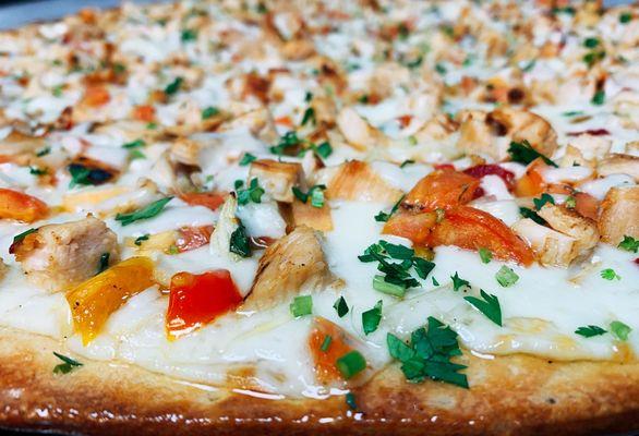 Chicken QuesaPizza with Pico de Angelo's, grilled chicken and mozzarella cheese.  Available by the slice or special order pre-orders.