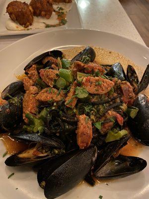 Squid ink linguini with sausage and mussels