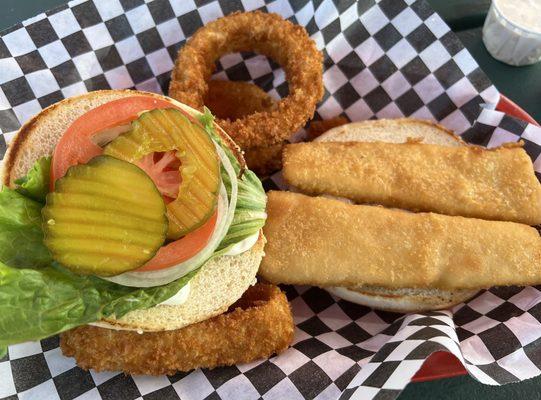 Fish sandwich with onion rings.