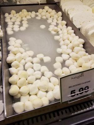 Old, yellow "fresh" mozzarella balls