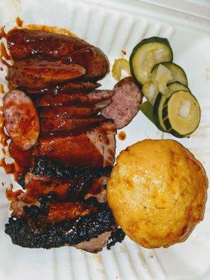 Sausage and Brisket Platter. Cornbread muffin & House Pickles.