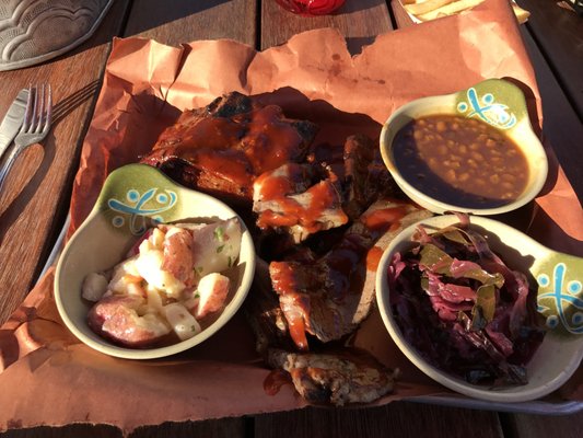 Brisket and baby back ribs tray with sides.  Very tasty !