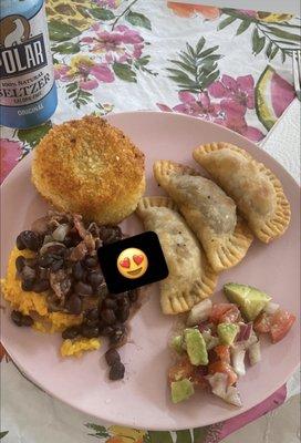 Cuban empanadas, mashed beef filled potato ball, rice and beans, with avocado salad