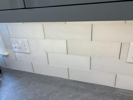 Graham white marble backsplash with gold edging