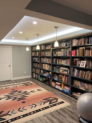 Basement remodeling with a build in wall library.