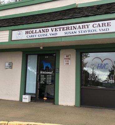 Front of vet. Located next to Dunkin Donuts & Chiropractor office.