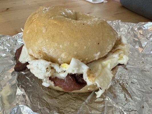 Delicious egg bacon and cheese on a plain bagel