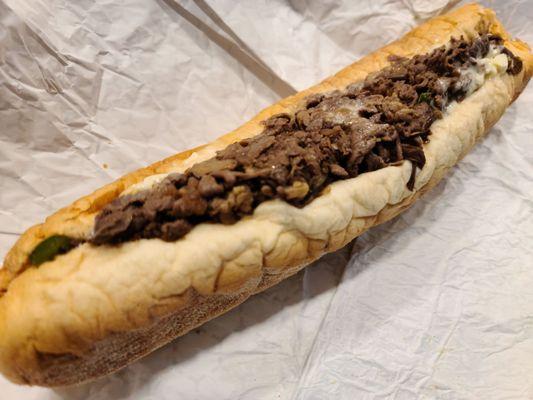 Cheesesteak with mushrooms, peppers, & onions.