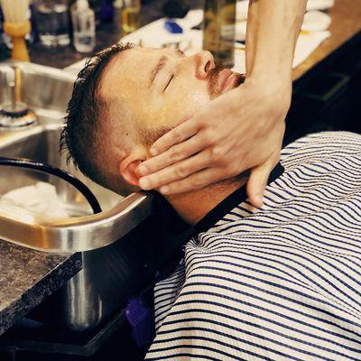 At The Parker Barber, our signature haircut service includes an invigorating hot face towel and a relaxing AVEDA aroma shampoo ritual.