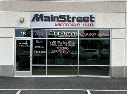 Main Street Motors storefront window.