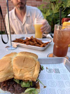 Holy Aioli with arugula, sweet potato fries, cocktail with gin and hibiscus.