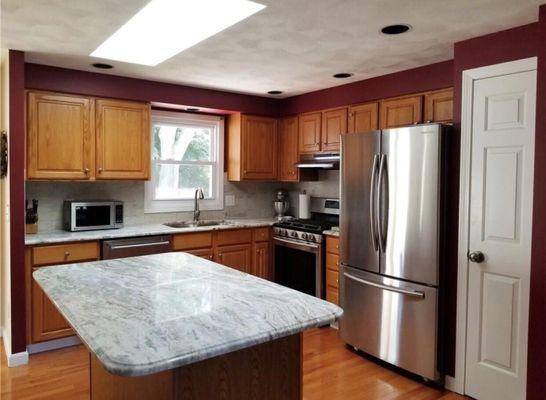 Finished kitchen with granite and backsplash