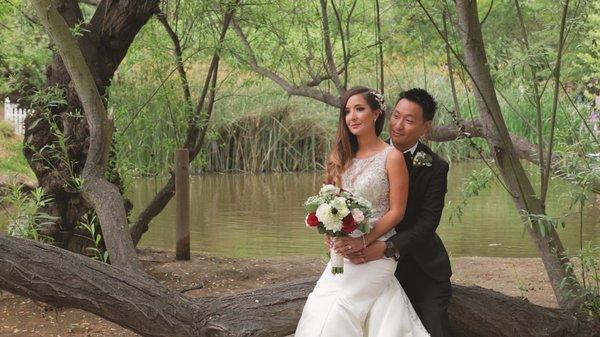 Calamigos Ranch Malibu A garden ceremony with a flowing waterfall backdrop and reception area surrounded by oak trees draped with twinkling