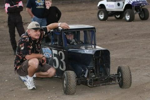 Here is a little racer in a mini dwraf car. Look at the smile on this kids face!