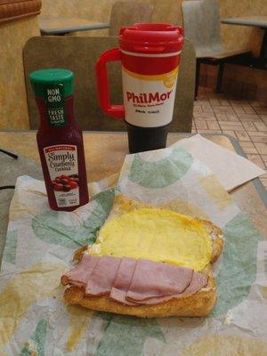 nicely toasted ham egg and cheese double meat. yellow egg. no veggies. juice and the coffee Bean to cup for the road