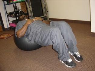 Bridging Exercises for low back pain on exercise ball.  Physical therapy to strengthen the core muscles.