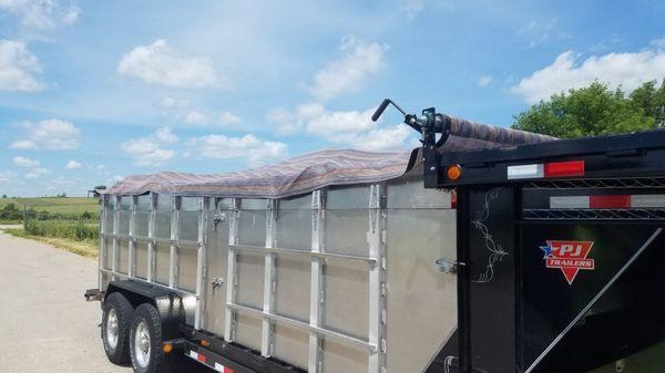 Our new tarp system to keep loose garbage from blowing out. That's why we are Your GREEN Solution!!