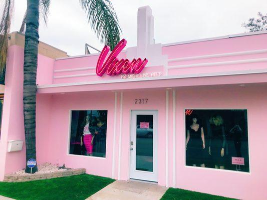 Our new location with our restored vintage Art Deco inspired building and Nights of Neon Vixen sign.