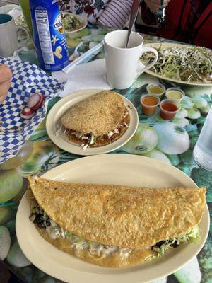 quesadilla de huitlacoche (bottom), Gordita de Chicharron Prensado Molido (top)