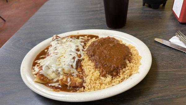 Cheese enchiladas with rice covered in meat sauce! The bomb!.