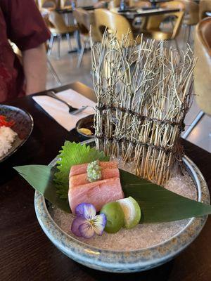 Fatty tuna sashimi with a baby peach.