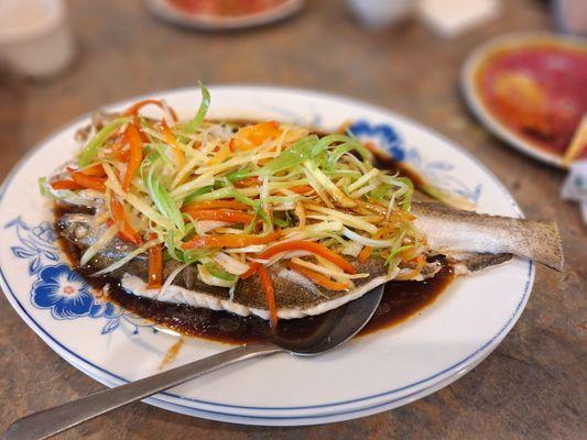 Steamed spotted trout with light soya sauce, ginger, and scallion...... available only on special occasions.