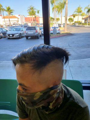 Horrible haircut.  He wanted a basic slick back with FADE.  She shaved him bald on the sides and not even.