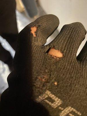 Ripped (probably unwashed) gloves provided as protective gear