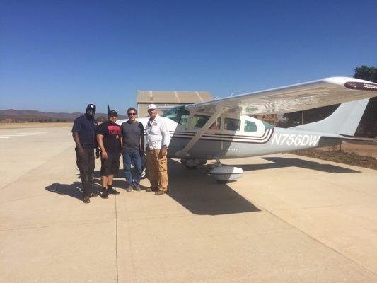 A team of dental techs flown down to install and repair dental chairs and Xray equipment.