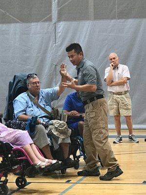 Instructor Jui Chiu teaches those with limited mobility.