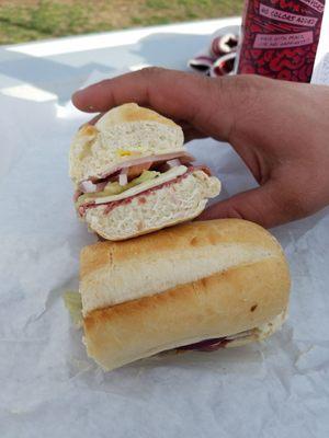 Corned beef and ham sandwich on a hoagie roll