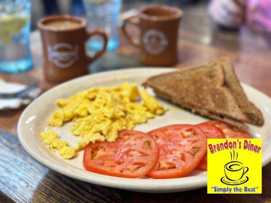 Two 2 Eggs Plate - tomato slices and wheat toast. Had really good coffee and attentive server. Great brunch all the way around.