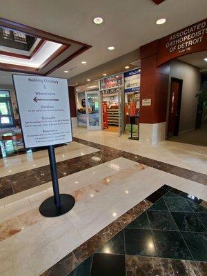 Main atrium of lobby displays helpful signs for your convenience while walking on the beautiful marble floors!  5/15/2023