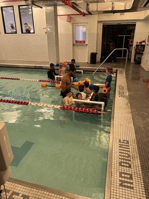 7 kids who can't swim with one instructor who is actually the deck manager. Completely chaotic and disorganized swim class.