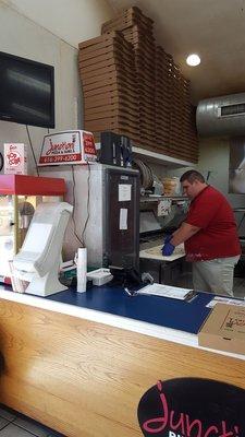 Making the delish pizza.  Best gas station pizza in West Olive, Mi.