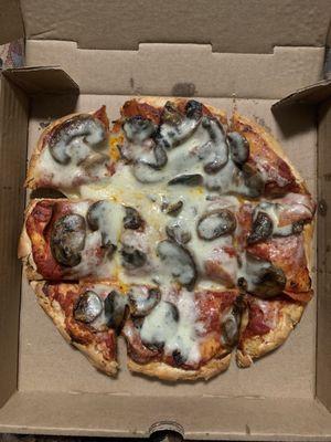 Small pepperoni and mushroom pizza.