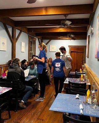 First floor dining room features tables made by Eagle Scout Jack McMonigle and painted by our staff!