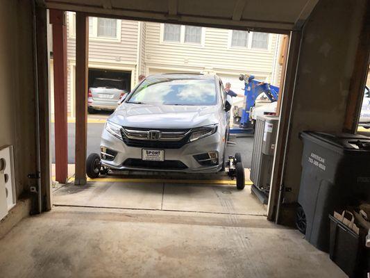 Notice the close proximity of the townhouses facing my garage.  Sean got the job done without scratching my Odyssey.