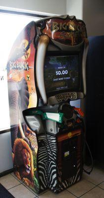 Customers can play Big Buck Hunter while waiting for their laundry.